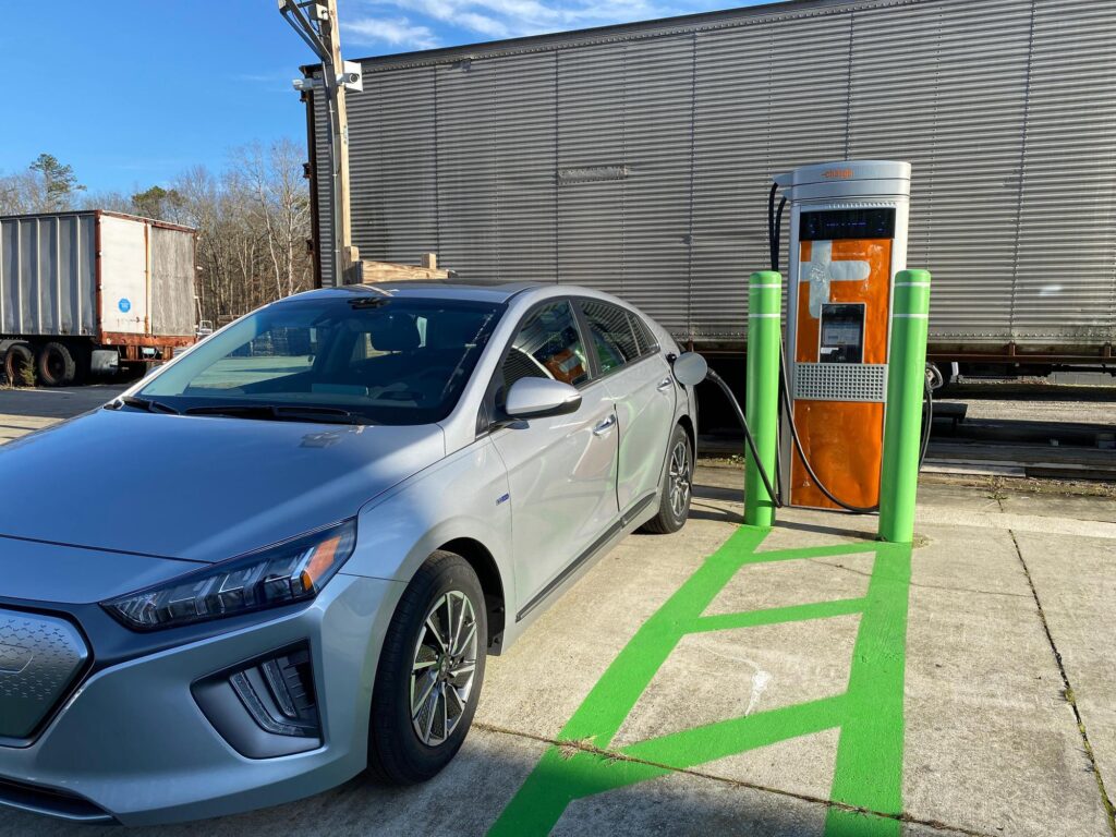 car hooked up to an electric charger